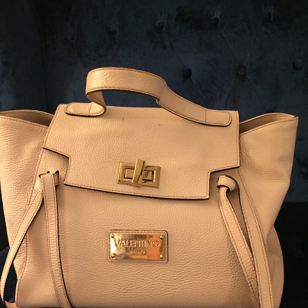 Valentino cow leather handbag in pale pink color.